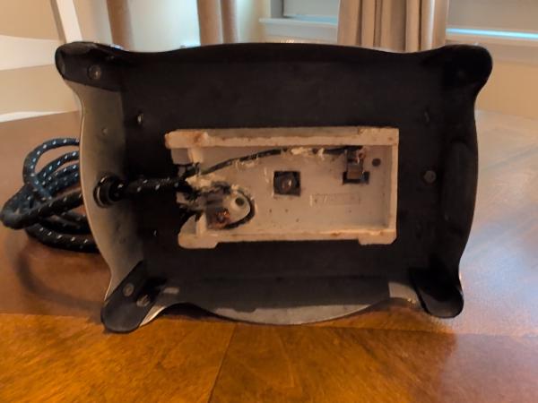 The bottom, where the junction box can be observed. This one has ceramic damage, so is lacking the wire retaining bar.